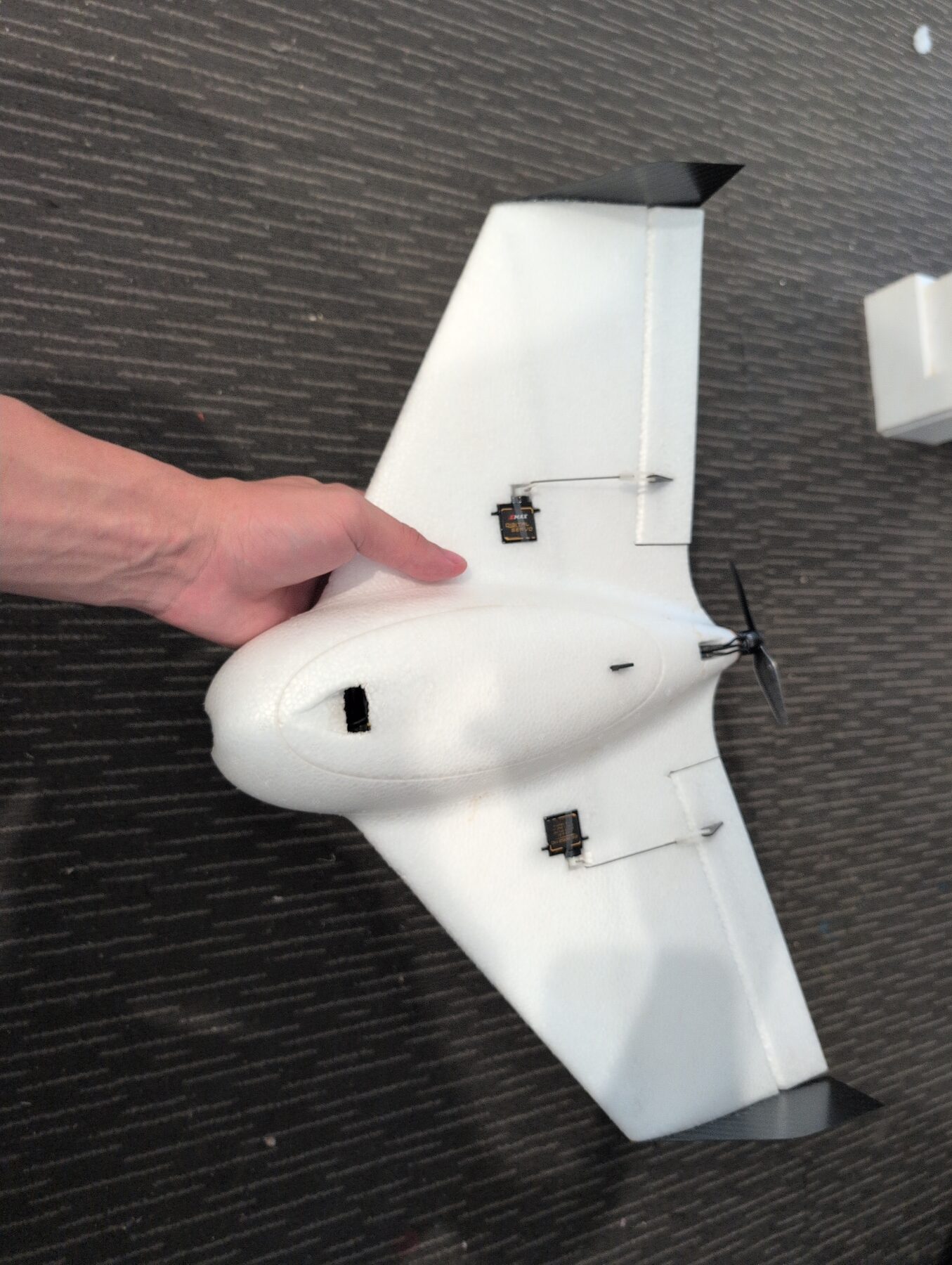 Samuel's compact Flik fixed-wing aircraft outdoors